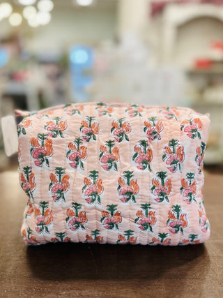 Tropic Bloom quilted mini tote bag with floral print

Pink tropical floral quilted mini tote bag with striped handles

Tropic Bloom quilted makeup bag with zipper closure

Quilted tropical floral cosmetic pouch in pink

Lightweight quilted mini tote bag with tropical flower pattern