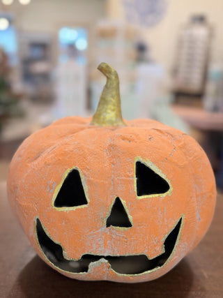 Orange Jack O Lantern Round Top featuring a classic smiling jack-o'-lantern face with gold accents.