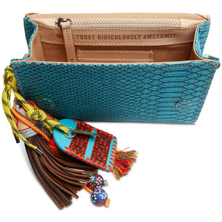 “Consuela Indy On The Town turquoise textured crossbody bag”

“Indy Consuela turquoise reptile-inspired On The Town bag with strap”

“Consuela Indy crossbody with magnetic closure and woven strap”

“Interior view of Consuela Indy On The Town with card slots and zipper pocket”

“Turquoise Consuela Indy crossbody with charm and leather trim”