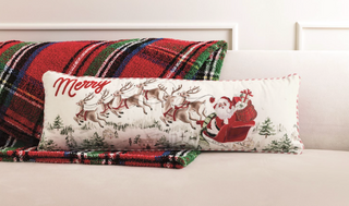 "Santa scene lumbar pillow with flying reindeer and Merry embroidery"

"Christmas lumbar pillow featuring Santa’s sleigh and reindeer design"

"Holiday decorative pillow with Santa, reindeer, and tartan backing"

