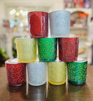 Swan Creek Shimmering Light Large Vase candles in assorted colors

Large soy wax candles in glitter swirl glass jars

Swan Creek 10 oz Shimmering Light candles with decorative glass design

Festive glass candles in red, green, yellow, and white hues

Colorful soy candles in elegant embossed vases by Swan Creek