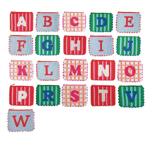 Initial Beaded Cases featuring hand-beaded monogram letters, colorful striped cotton canvas, scalloped trim, and zipper closures.