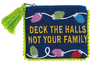Holiday Pom Cases featuring needlepoint embroidered holiday sayings, colorful pom trim, tassel zipper pulls, and fully lined cotton interiors.