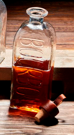 Clear glass bourbon decanter with embossed lettering and leather lid

Bourbon glass decanter with cork and leather stopper on wood surface

Elegant whiskey decanter with embossed bourbon text

Handcrafted glass bourbon bottle with leather accent lid

Stylish bourbon decanter for bar cart or home bar display