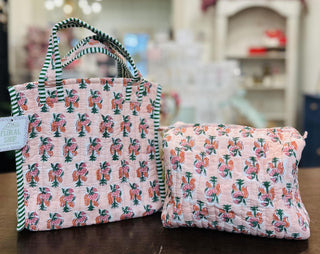 Tropic Bloom quilted mini tote bag with floral print

Pink tropical floral quilted mini tote bag with striped handles

Tropic Bloom quilted makeup bag with zipper closure

Quilted tropical floral cosmetic pouch in pink

Lightweight quilted mini tote bag with tropical flower pattern