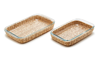 Borosilicate glass baking dish with woven natural basket for oven-to-table serving.