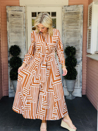 Uncle Frank Carmen Shirt Dress with geometric print, button-front design, long sleeves, pockets, and optional tie belt.