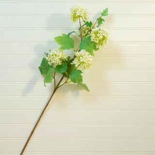 31-inch faux white flowering pick with delicate white blooms, green leaves, and flexible wire stem for floral arrangements, centerpieces, and seasonal home décor.