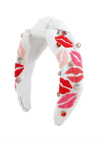 Valentine beaded headband with hearts and rhinestones

Red Valentine headband with hand-beaded heart details

Pink Valentine top-knot headband with rhinestones and beads

White Valentine beaded headband with lip motif

Valentine themed beaded cotton headband with top knot
