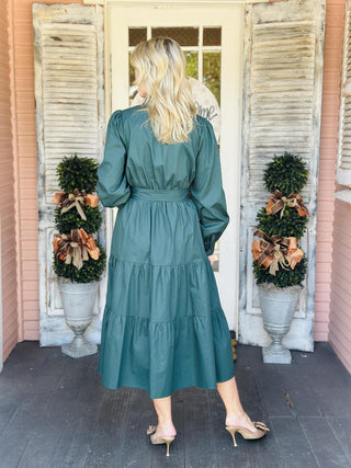 "Laney Dress in sea green with V-neckline, waist tie belt, long sleeves, and tiered hem"

"Sea green midi dress with adjustable waist belt, V-neck, and side pockets – Laney Dress"

"Women’s long sleeve wrap-style dress in sea green with tie waist and pockets"