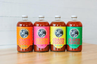 Bloody Darn Good Bloody Mary Mix bottles in assorted flavors

Colorful Bloody Darn Good Mixes lineup on wooden counter

Bloody Mary mix bottles labeled Hot Mama, OG, Morning Light, and Dill Pickle

All-natural Bloody Darn Good cocktail mixers displayed in glass bottles

Bloody Darn Good Mix variety pack of handcrafted Bloody Mary mixes