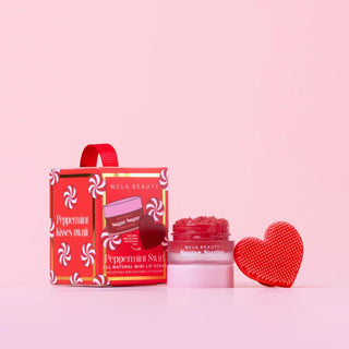 CLA Beauty Lip Scrub Gift Set with heart-shaped scrubber and holiday ornament box

Peppermint Swirl mini lip scrub set with red silicone heart scrubber

Merry Berry Rosé mini lip scrub set with pink heart scrubber and gift box

Holiday lip care gift set with Sugar Sugar Lip Scrub ornament packaging

Festive lip scrub ornament with heart exfoliator and mini Sugar Sugar scrub