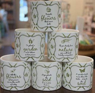 White ceramic garden cachepot with green botanical pattern and inspirational gardening quote, 6-inch decorative planter.