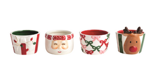 Hand-painted ceramic Christmas tidbit dishes featuring festive designs including holly, Santa, bows, and a reindeer with dimensional exterior details.