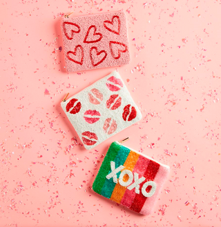 Valentine beaded zip pouch with heart design

Pink beaded Valentine coin purse with hearts

Beaded Valentine pouch with lips pattern

XOXO rainbow beaded zip case for Valentine’s Day

Small Valentine beaded cosmetic pouch on pink background