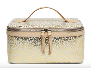 Consuela Kit Train Case with gold jag print foiled leather exterior and top handle

Open Consuela Kit Train Case showing pink vinyl interior and brush organizers

Gold jag print Consuela Kit Train Case cosmetic organizer with double zip closure

Consuela Kit Train Case travel makeup case with structured interior and mesh pocket