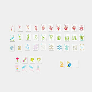 Mini Mahjer Just The Tiles Beach Edition American Mahjong game with 160 beach-themed plastic tiles, magnetic storage box, and drawstring tile bag.