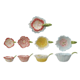 Set of four floral shaped ceramic prep bowls with petal edges and leaf handles