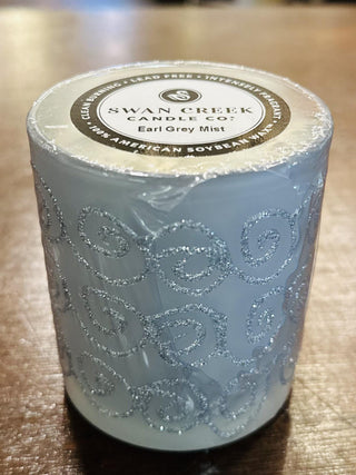 Swan Creek Shimmering Lights Small Vase Candles in assorted colors

Glitter swirl glass candles by Swan Creek in red, green, yellow, and white

Shimmering soy wax candles in colorful glass vases

Small Swan Creek candle collection with decorative swirls

Festive glass vase candles with soy wax by Swan Creek