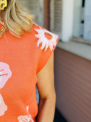 Mariah floral knit sweater vest featuring pink, white, and green flower details