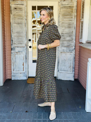 Black floral puff sleeve dress with pink and green print

Mallory Dress in black featuring pink floral pattern and gathered neckline

Black and olive floral long dress with vintage-inspired print
