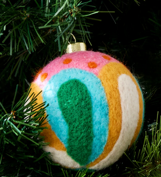 Christmas ornaments with nutcracker and candy cane designs

Handmade felt ornaments with bright candy cane and holiday shapes

Colorful felt Christmas ornaments featuring nutcracker and retro shapes

Festive felt ornaments with candy cane and pink bow details

Whimsical Christmas tree ornaments made from colorful felt