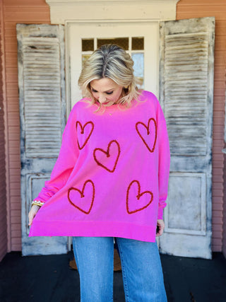 Pink Valentine sweatshirt with sequin heart details

Valentine heart sparkle sweatshirt with tinsel appliqué

Pink cotton blend Valentine sweatshirt with hearts

Women’s Valentine sweatshirt with glitter heart design

Oversized Valentine heart sweatshirt styled casually