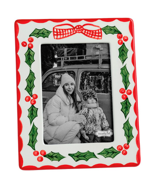 Hand-painted Holly Frame with festive holly leaves, red berries, bow detail, and easel back, available for 4" x 6" and 5" x 7" photos.