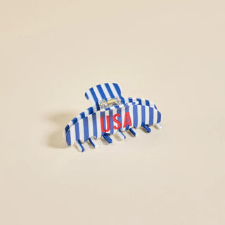 Blue and white striped USA claw hair clip with red lettering