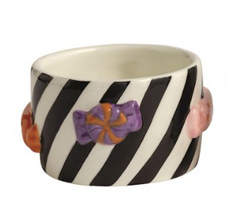 Hand-painted ceramic Halloween tidbit dishes with black and orange striped designs featuring raised ghost, skull, candy corn, bat, and bow accents.