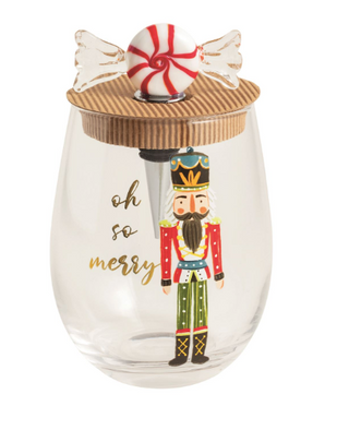 Peppermint Nutcracker stemless wine glass with festive stopper

Holiday wine glass with nutcracker illustration and peppermint stopper

Christmas-themed wine glass and stopper set

"Oh So Merry" nutcracker wine glass with peppermint candy topper