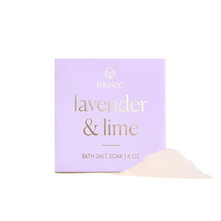 Musee Lavender & Lime mini bath salt soak with pastel purple packaging and loose salts