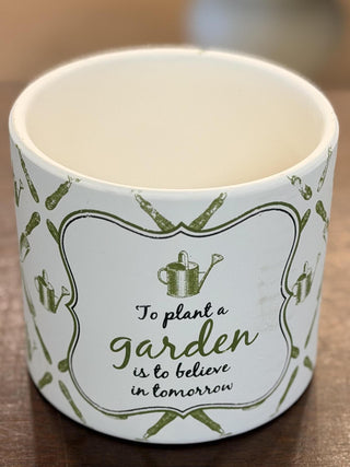 White ceramic garden cachepot with green botanical pattern and inspirational gardening quote, 6-inch decorative planter.