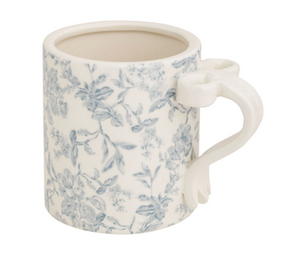 Decorative ceramic mug with 3D bow handle