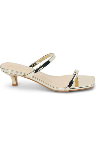 Gold double-strap kitten heel sandal with square toe

Shiny gold slip-on sandal with low heel and padded insole

Metallic gold vegan sandal with two straps and kitten heel

Square-toe gold sandal with faux leather finish