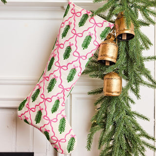 Christmas stocking with pink bow and green spruce pattern

Spruce and pink ribbon embroidered holiday stocking

Festive pink and green Christmas stocking on mantel

Decorative holiday stocking with bows and greenery

Whimsical embroidered stocking with spruce and ribbon design
