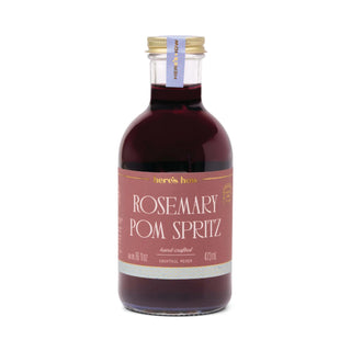 “Rosemary Pom Spritz cocktail mixer bottle on white background”

“Rosemary pomegranate spritz mixer in glass bottle”

“Handcrafted Rosemary Pom Spritz mixer 473mL”

“Pomegranate rosemary spritz drink mixer”

“Red spritz cocktail mixer with rosemary flavor”