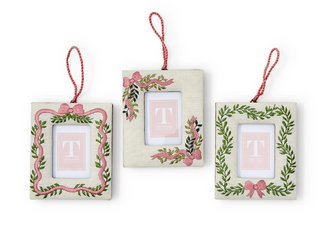 “Embroidered photo frame ornament with pink ribbon and greenery”

“Fabric hanging frame ornament with pink bow embroidery”

“Small decorative photo frame ornament with embroidered wreath design”

“Holiday embroidered frame ornament with ribbon loop”

“Set of embroidered hanging photo frame ornaments in assorted designs”