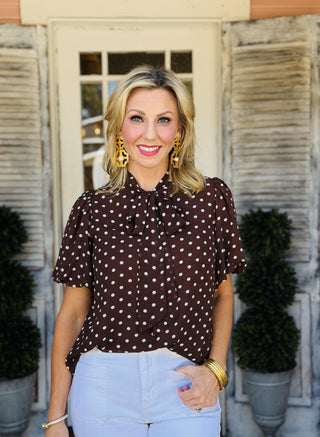 Mary Top brown woven polka dot blouse with puff sleeves and bow tie neckline