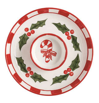 Hand-painted ceramic Holly Chip & Dip Set featuring a holly wreath serving tray, removable candy cane dip bowl, and coordinating metal spreader with ceramic handle.