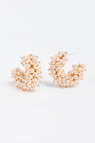 Gold-plated hoop earrings with clusters of faux pearls and gold bead accents

Statement pearl hoop earrings with gold-plated brass posts

Talulah Hoop Earrings featuring faux pearls and gold detailing