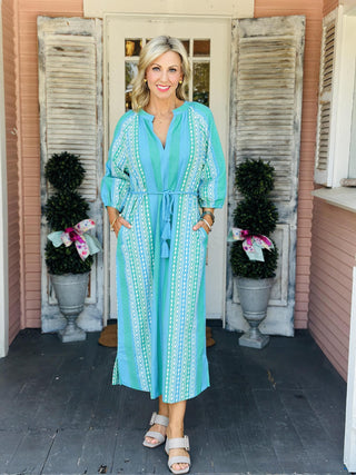 Women’s Molly Dress patterned maxi dress featuring split neckline, three-quarter sleeves, and tassel belt