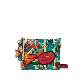 Consuela Dezi Downtown Crossbody with colorful floral embroidery, turquoise pattern, natural leather trim, and adjustable woven strap