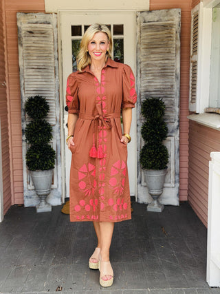 Uncle Frank Thea Dress in brown with vibrant pink embroidery, puff sleeves, collared neckline, pockets, and removable waist belt.