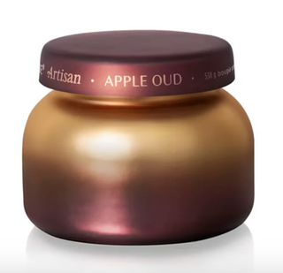 Apple Oud Radiance Signature Candle in bronze and burgundy ombré glass jar