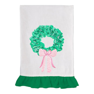 White tea towel with green sequin wreath and pink bow

Holiday wreath tea towel with green sequins and ruffle trim

Christmas kitchen towel with sparkly sequin wreath design

Embellished holiday tea towel with pink bow and green ruffle

Festive embroidered wreath towel with sequins and ruffle edge
